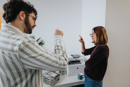 Multiracial colleagues collaborating in a pleasant atmosphere at the corporate office.の写真素材