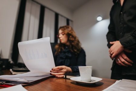 Professionals strategize in a modern office, discussing business growth, digital marketing, and...