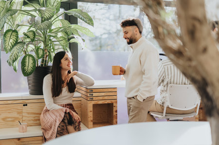 Young professionals collaborate in a modern office, planning strategies for business growth and...