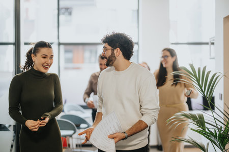 Successful business team discussing and strategizing for profit growth while walking in the hall at big business center.の写真素材