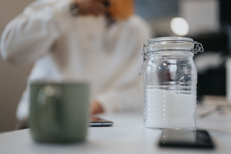 Colleagues enjoying a pleasant atmosphere in a modern kitchen.の写真素材