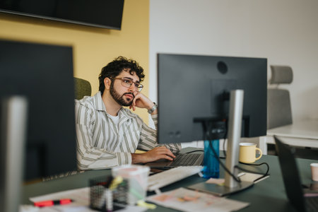 A confident business person strategizing in a corporate office for profit growth and market expansion.の写真素材