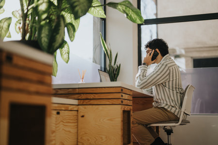 Businessman working alone at modern office setting.の写真素材