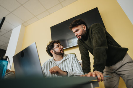 Dynamic corporate team collaborating in a creative office for market research and project planning.