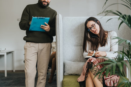 Collaborative adult coworkers discussing data analytics and strategizing for profit growth in a corporate office.の写真素材