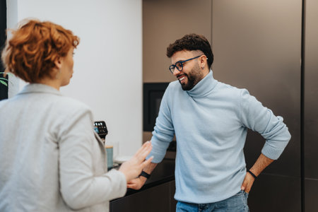 Business professionals collaborating over tea in a pleasant office atmosphereの写真素材
