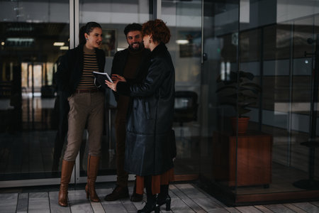 Business partners collaborating on marketing strategy in the city area on a cloudy dayの写真素材