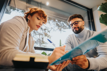Confident colleagues collaborating in a creative office for business development and innovation.の写真素材