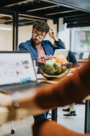 Diverse team analyzing statistics and sharing ideas for business expansion and profit growth.の写真素材