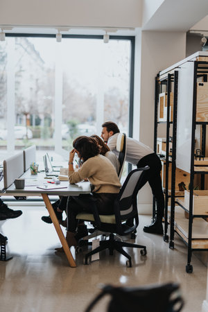 Young group of coworkers collaborating on successful project solutions in a modern office.の写真素材
