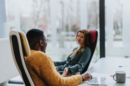 Successful multigenerational team of creative entrepreneurs discussing innovative strategies for workplace growthの写真素材