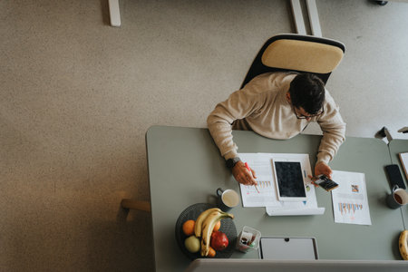 Successful businessman working and discussing innovative strategies for business growth in a modern office environment.の写真素材
