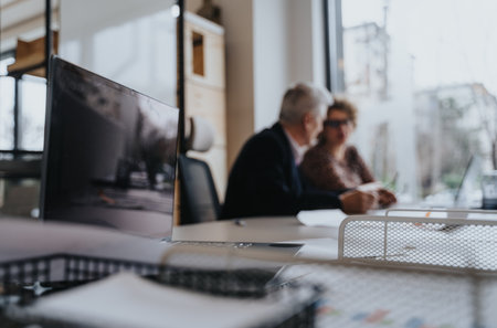 Colleagues collaborating on business strategies and planning projects in an innovative office, working as a successful team.の写真素材