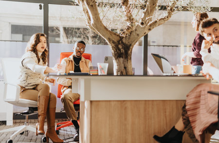Business teammates projects, strategizing, and sharing ideas in a positive atmosphere. Successful...