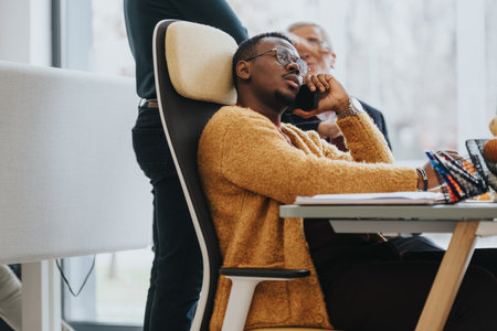 Thoughtful businessman in casual meeting at modern office space.