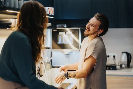 Colleagues enjoying a positive atmosphere in the office kitchen.の写真素材