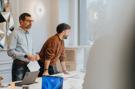 Professional Men Collaborating in Bright Modern Office.