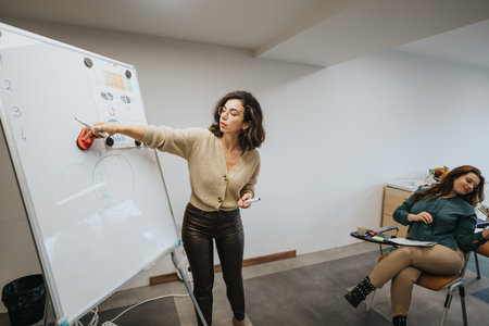 Focused woman presenting business strategy on whiteboard in meeting room