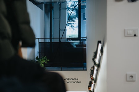 Multiracial business colleagues discussing and strategizing for project in a corporate office with a pleasant atmosphere.の写真素材