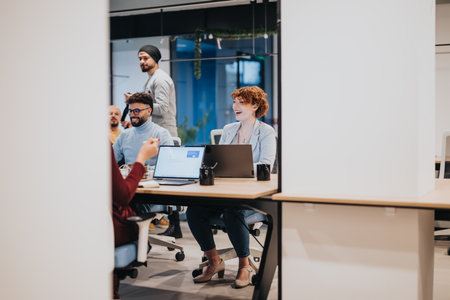 Business professionals discussing marketing strategy and financial growth in a pleasant office atmosphere.の写真素材