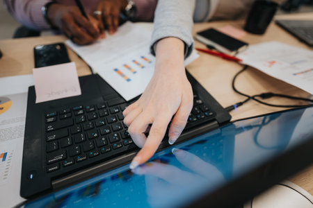 Diverse business professionals collaborate, discuss marketing strategies, and analyze market segmentation for financial growth.の写真素材