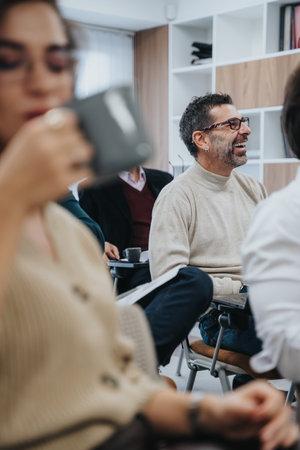 Casual business meeting with diverse team listening and engaging.