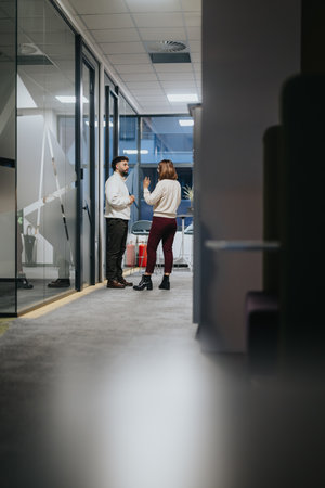 Multigenerational group of coworkers strategizing and discussing business growth opportunities in an indoor meeting.の写真素材