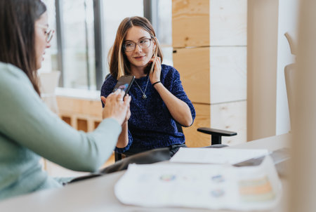 A female group of confident businesspeople discussing ideas for company expansion and innovation in...