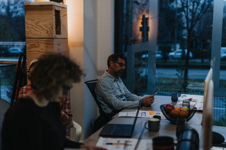 Senior team of confident businesspeople working on innovative project in modern office.