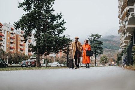 Multiracial business couple walking together on cloudy evening after work.の写真素材