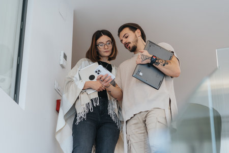 Successful collaboration of young, confident coworkers in a modern office.の写真素材