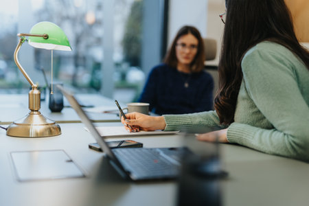 Successful business females working together in office for creative solutions.の写真素材