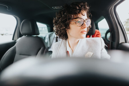 Confident businesswoman in a car, focused and ready for the workday aheadの写真素材