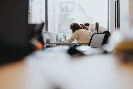 Young business colleagues working together in a modern co working space.の写真素材