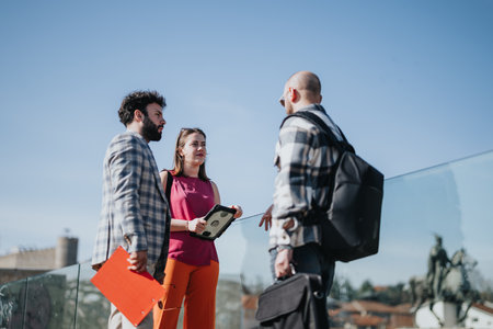 Young business partners discussing strategy in an urban city area