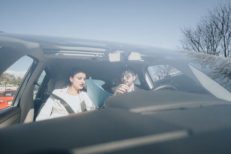 Professional team on a business trip, traveling in a car together