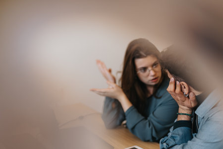 Young professionals collaborating on creative business solutions.の写真素材