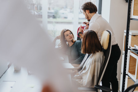 Multicultural business team collaborating in a modern workplace.の写真素材