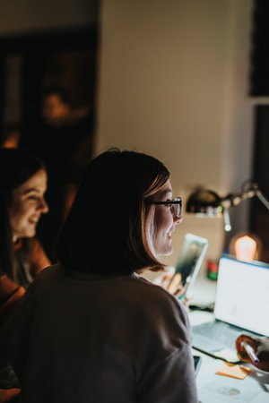 Working Together on Late Night Project Deadline in Creative Office