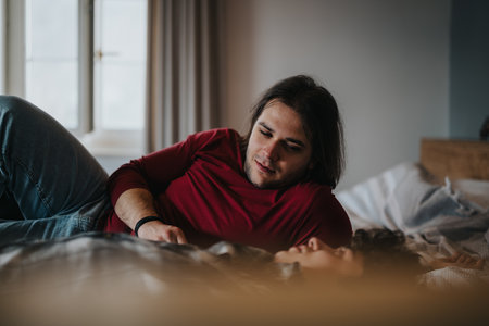 Friends relaxing together in a cozy home environmentの写真素材