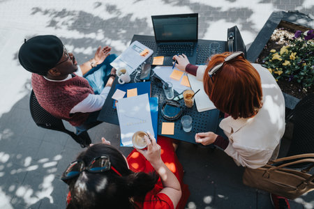 Entrepreneurial team strategizing at an outdoor business meetingの写真素材