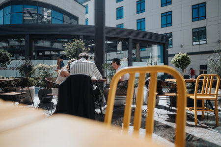 Business colleagues meeting at an outdoor cafe in the city