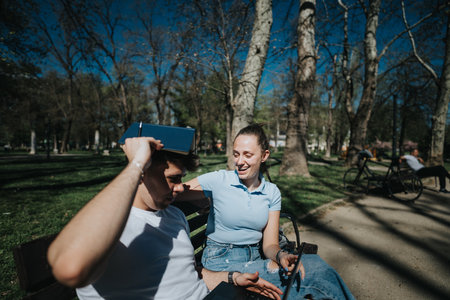 College students sharing knowledge while enjoying a sunny day in the park