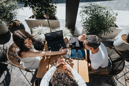 Entrepreneurs brainstorming at a coffee bar, discussing reports for business growth