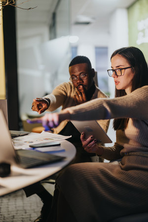 Multiracial people strategizing in an office meeting, discussing business growth, market expansion,...
