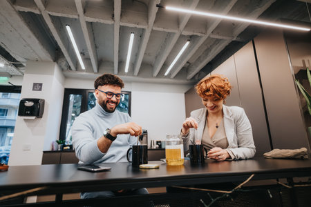 Multicultural business team discussing marketing strategies and planning tasks in a pleasant office atmosphere.の写真素材