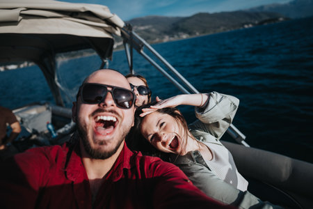 Friends enjoying a sunny boat trip on the lake, capturing fun selfie moments together