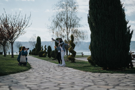 Friends enjoying a fun day outdoors, capturing memories by the lakeside