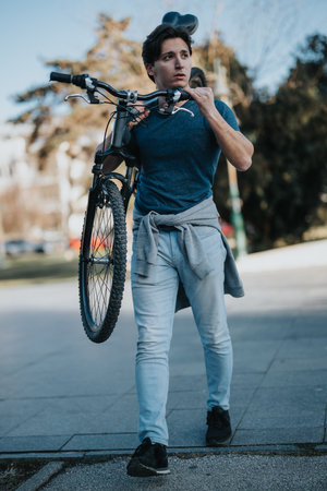 Man enjoying a relaxing day with his bicycle in the parkの写真素材