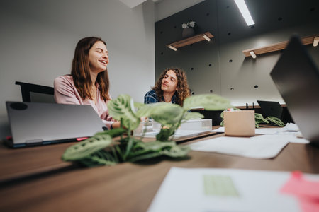 Young business colleagues collaborating on project in modern office setting